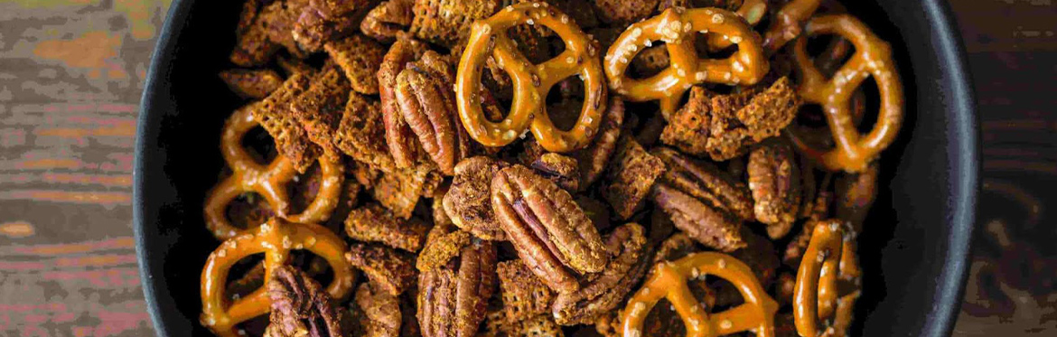 Sweet and Salty Pecan Snack Mix in Green Bowl